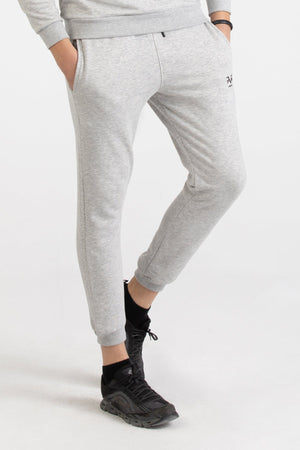 Close-up of heather grey Versace 19.69 joggers featuring a drawstring waist and small 19V69 logo on the thigh.