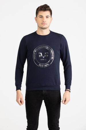 Close-up view of navy blue Versace 19.69 joggers featuring a drawstring waist and small silver 19V69 Italia logo on the thigh.