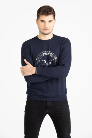 Close-up view of navy blue Versace 19.69 joggers featuring a drawstring waist and small silver 19V69 Italia logo on the thigh.