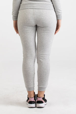 Front view of heather grey Versace 19.69 joggers for women featuring a black 19V69 Italia logo on the thigh and ribbed ankle cuffs.
