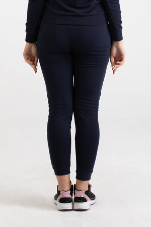 Front view of navy blue Versace 19.69 joggers for women featuring a metallic gold 19V69 Italia logo on the thigh and a drawstring waist.