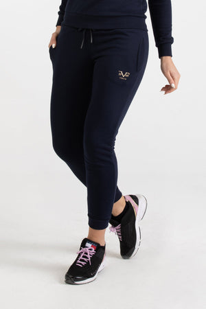 Front view of navy blue Versace 19.69 joggers for women featuring a metallic gold 19V69 Italia logo on the thigh and a drawstring waist.